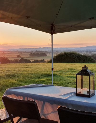 Sunrise over the Vale from a gazebo in the Top Field