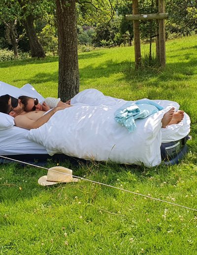Guests sleeping off the night before in the orchard