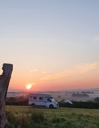 Camper van at sunrise